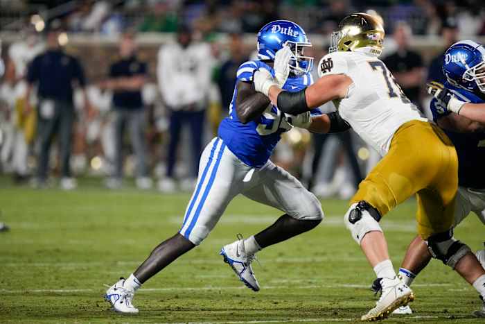 Sep 30, 2023; Durham, North Carolina, USA; Duke Blue Devils defensive end R.J. Oben (94) tries to get past the block of Notre Dame Fighting Irish offensive lineman Joe Alt (76) during the second half at Wallace Wade Stadium.